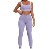 Women contrasting backless sports vest and yoga culottes