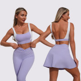 Women contrasting backless sports vest and yoga culottes