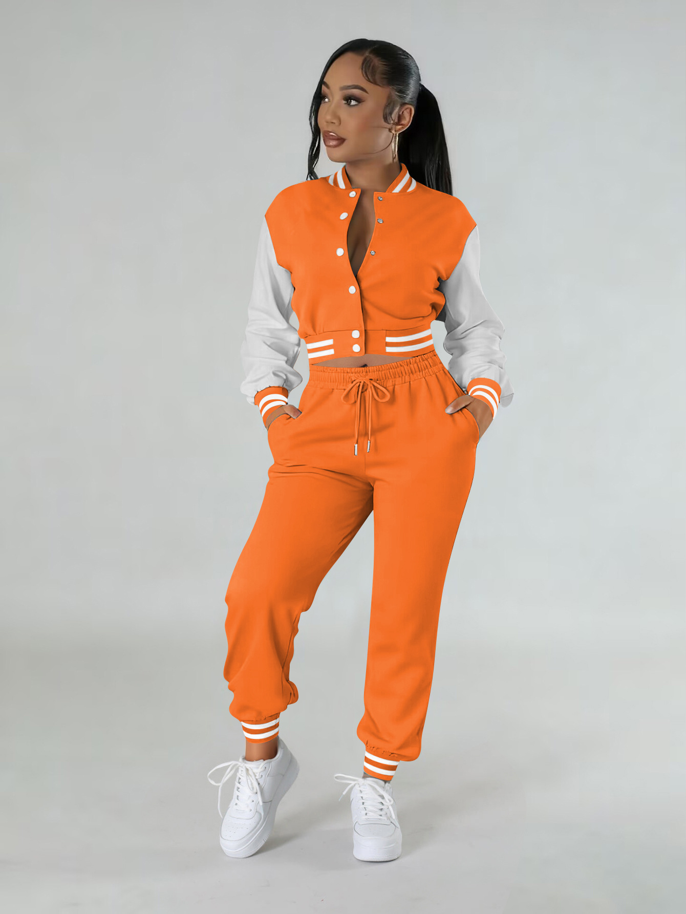 Women contrasting color baseball top and pant two-piece set