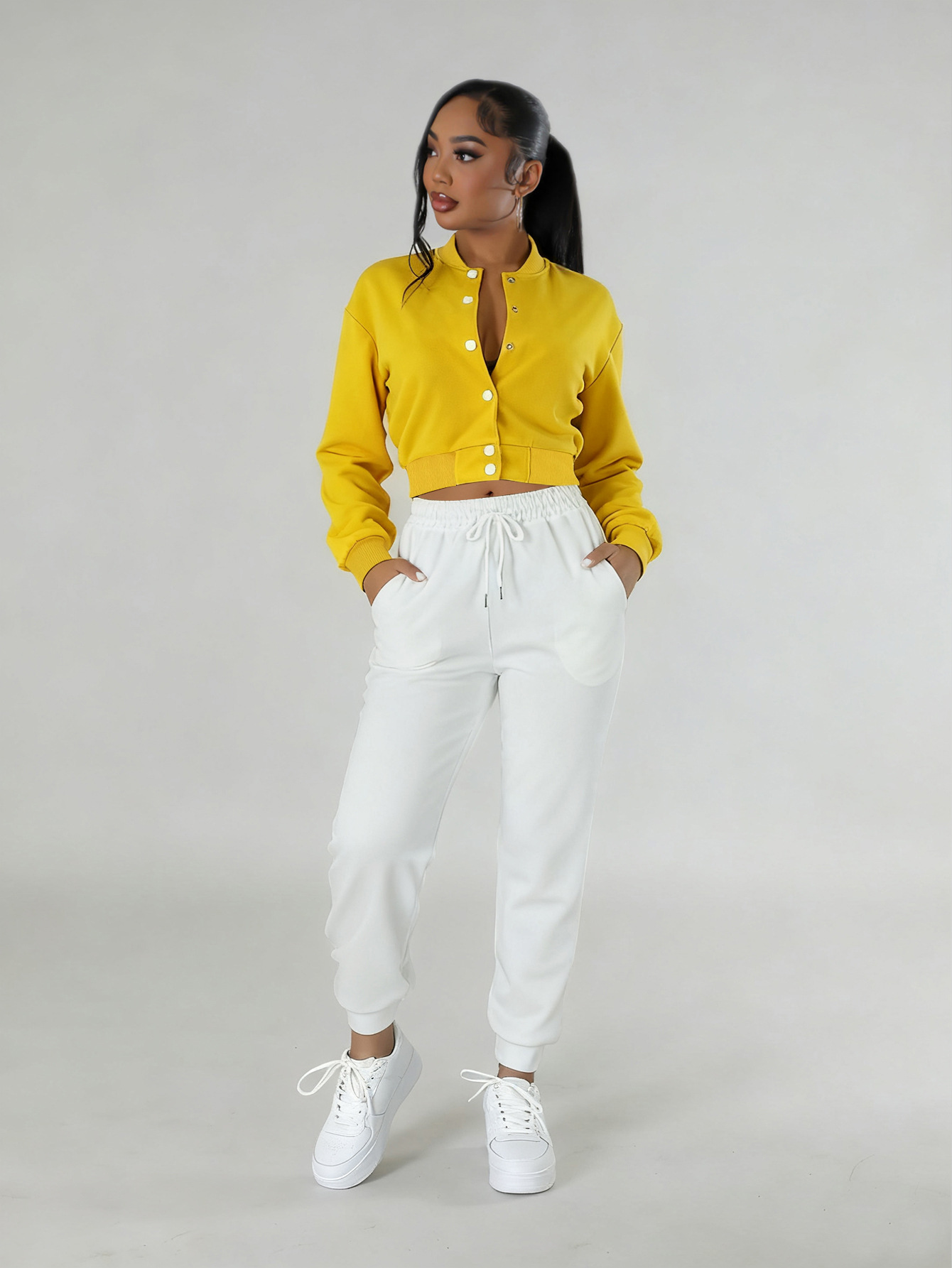 Women contrasting color baseball top and pant two-piece set