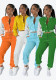 Women contrasting color baseball top and pant two-piece set