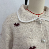 Women's Turndown Collar Heart Print Jacquard Knit Color Block Pearl Button Sweater