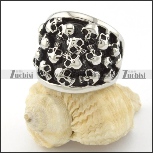 heavy ring with numerous small skull heads r001144