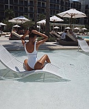 Chanel Luxury White Embossed CC Logo One-Piece with Ruffle Trim