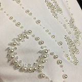 Chanel Luxury White Crewneck T-Shirt with Pearl-Embellished Logo Lettering