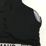 Chanel Luxury Monochromatic Cropped Sports Bra & Leggings Set with Signature Branding