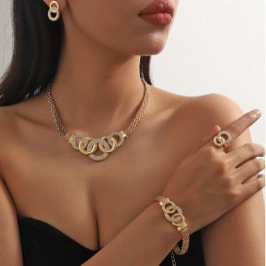 Five piece set of fashionable and gorgeous rhinestones with crossed circular necklaces, earrings, bracelets, and rings