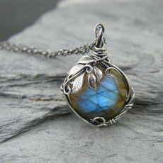 Vintage and personalized leaf wrapped moonstone pendant with fashionable inlay and edging necklace