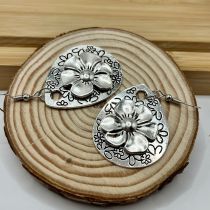 Water droplet shaped carved flower pendant earrings