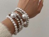 Exaggerated pearl studded diamond layered bracelet set