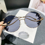 Frameless cut edge inlaid diamond sunglasses, fashionable round rhinestone sunglasses with wave design