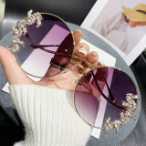 Frameless cut edge inlaid diamond sunglasses, fashionable round rhinestone sunglasses with wave design