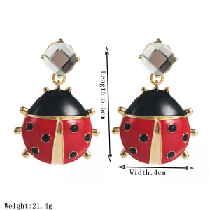 Unique red crystal ladybug earrings with niche design