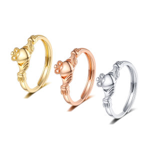 Crown Love Ring held in the palm of the hand, couple's matching ring with adjustable opening