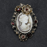 Rhinestone beauty head brooch electroplated alloy retro chest flower women's clothing accessory pin