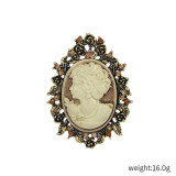 Rhinestone beauty head brooch electroplated alloy retro chest flower women's clothing accessory pin