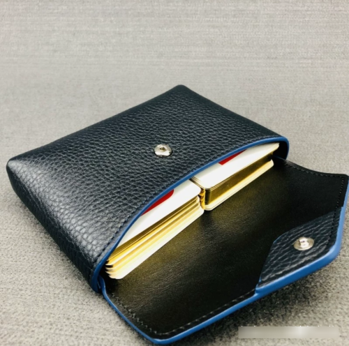 Roger Dubuis leather handbag and commemorative poker