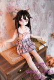 Mini TPE love doll dressed in pastel pink Japanese schoolgirl outfit