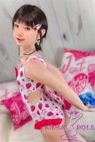 Side pose of J-cute AA-cup doll wearing cute one-piece bathing suit