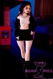 XS Hilary cinnamon skin tone doll with pick hair – front standing pose

