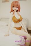 Close-up of Yui-B anime doll head with orange hair and lace outfit