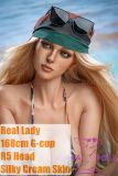Real Lady 168cm silicone sex doll with R5 head wearing a bikini on a sunny beach
