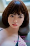 Close-up of GE43 head with sweet facial expression and short dark hair