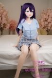 Anime-style sex doll Anna wearing blue checkered mini skirt