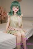 Anime-style sex doll Anna wearing green outfit and soft pink bow