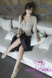 Sitting pose realistic female doll