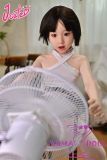 Sitting silicone doll by electric fan