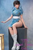 Full silicone doll seated pose