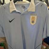 2026/27 Uruguay Home Fans Soccer Jersey (Have Right Patch 有右臂章 金底白字）
