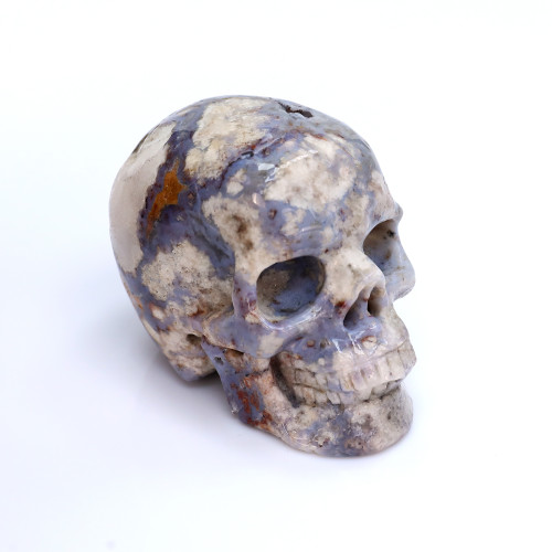 A small blue agate skull carving natural human skull crystal feng shui model gift
