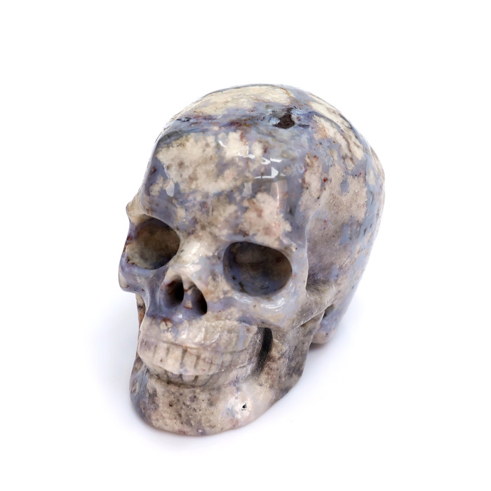A small blue agate skull carving natural human skull crystal feng shui model gift