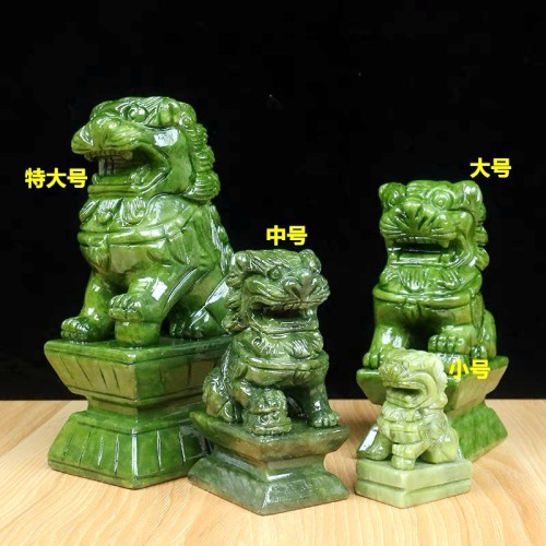 Hand-carved green jade animal carvings, green jade crystal lion climbing, and home decoration