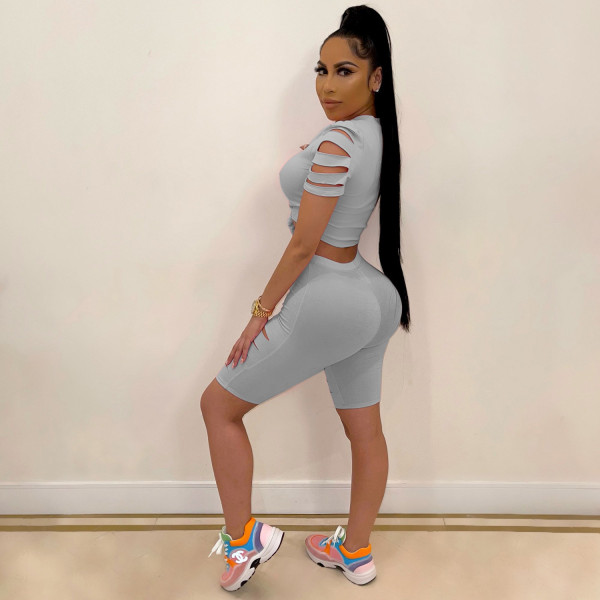 Two-piece sexy casual sports suit with solid color burnt holes and navel exposed A3277