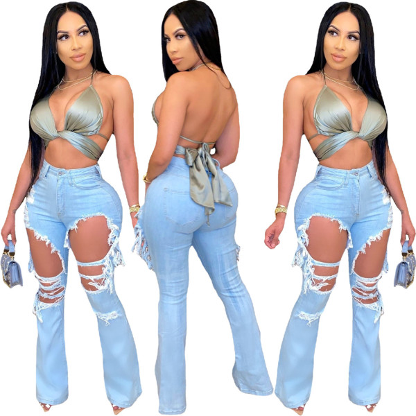 Cut torn holes and wash water to make old flared fashionable casual jeans A3272