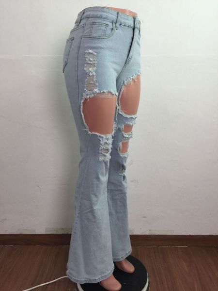 Cut torn holes and wash water to make old flared fashionable casual jeans A3272