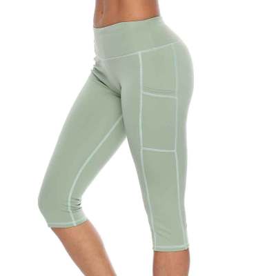New style yoga pants solid color peach hip tight-fitting slimming sports seven-point side pocket quick-drying fitness women's pants 593472933285-1