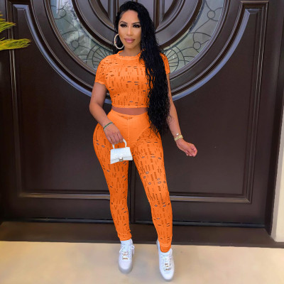 Autumn and summer women's fashion sexy ripped round neck solid color sports two-piece suit Y10016