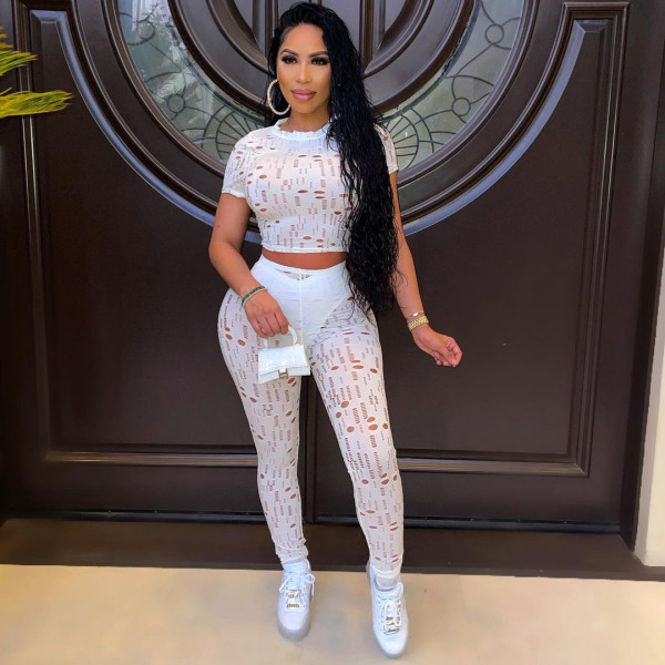 Autumn and summer women's fashion sexy ripped round neck solid color sports two-piece suit Y10016
