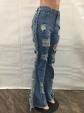 Front and rear ripped loose tassel flared jeans