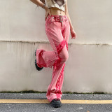 Low-rise denim flared trousers with metal waist buttons
