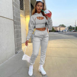 three-piece fleece drawstring hoodie with cotton tank top and jogger pants