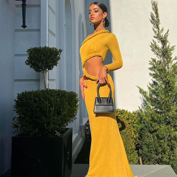 Personalized hollow bag buttocks twist wrapped hem long sleeve fishtail dress