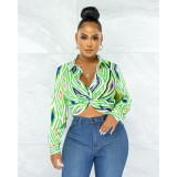 Fashion geometric printing twist button shirt top
