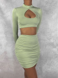 Autumn and winter sexy hollow out long sleeved hip wrap skirt pleated open navel two-piece set