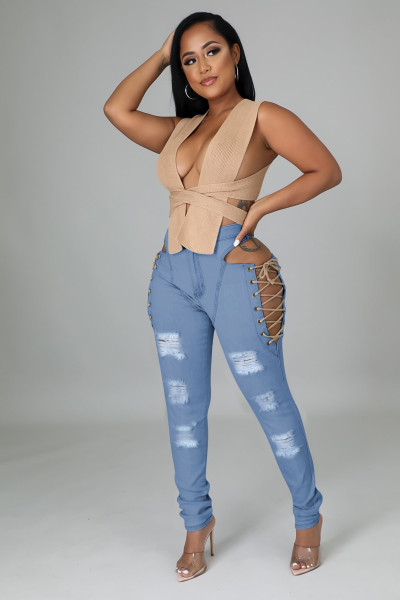 Worn jeans with cornhole strap