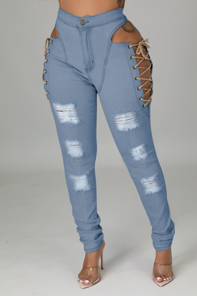 Worn jeans with cornhole strap